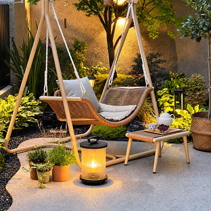 Tall Torre outdoor garden light standing as a floor lantern on a backyard deck