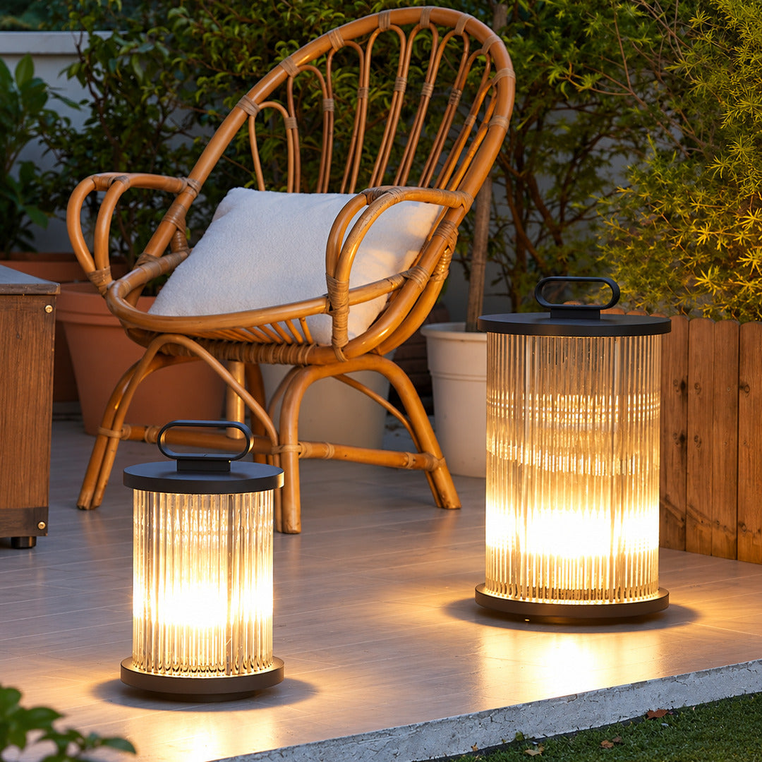 Torre outdoor garden light on a patio adding a warm ambient glow at night