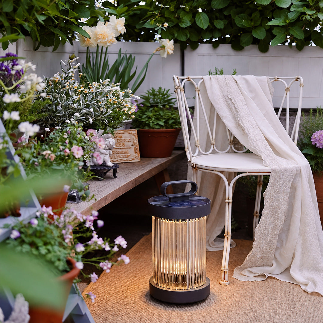 Torre outdoor garden lights illuminating a villa courtyard with a warm retro glow
