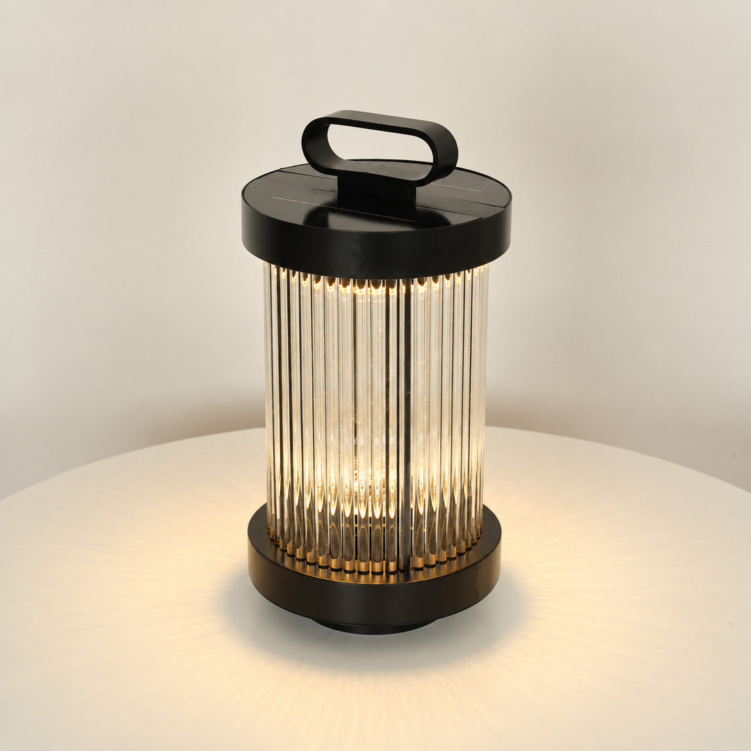 Small 14.2-inch solar Torre outdoor garden light staked in a flower bed