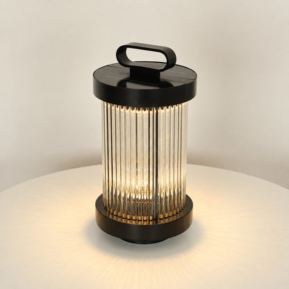 Small 14.2-inch solar Torre outdoor garden light staked in a flower bed