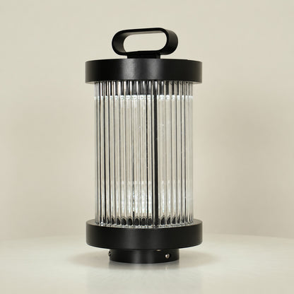 Close-up of the cylindrical frosted glass body of the Torre outdoor garden light