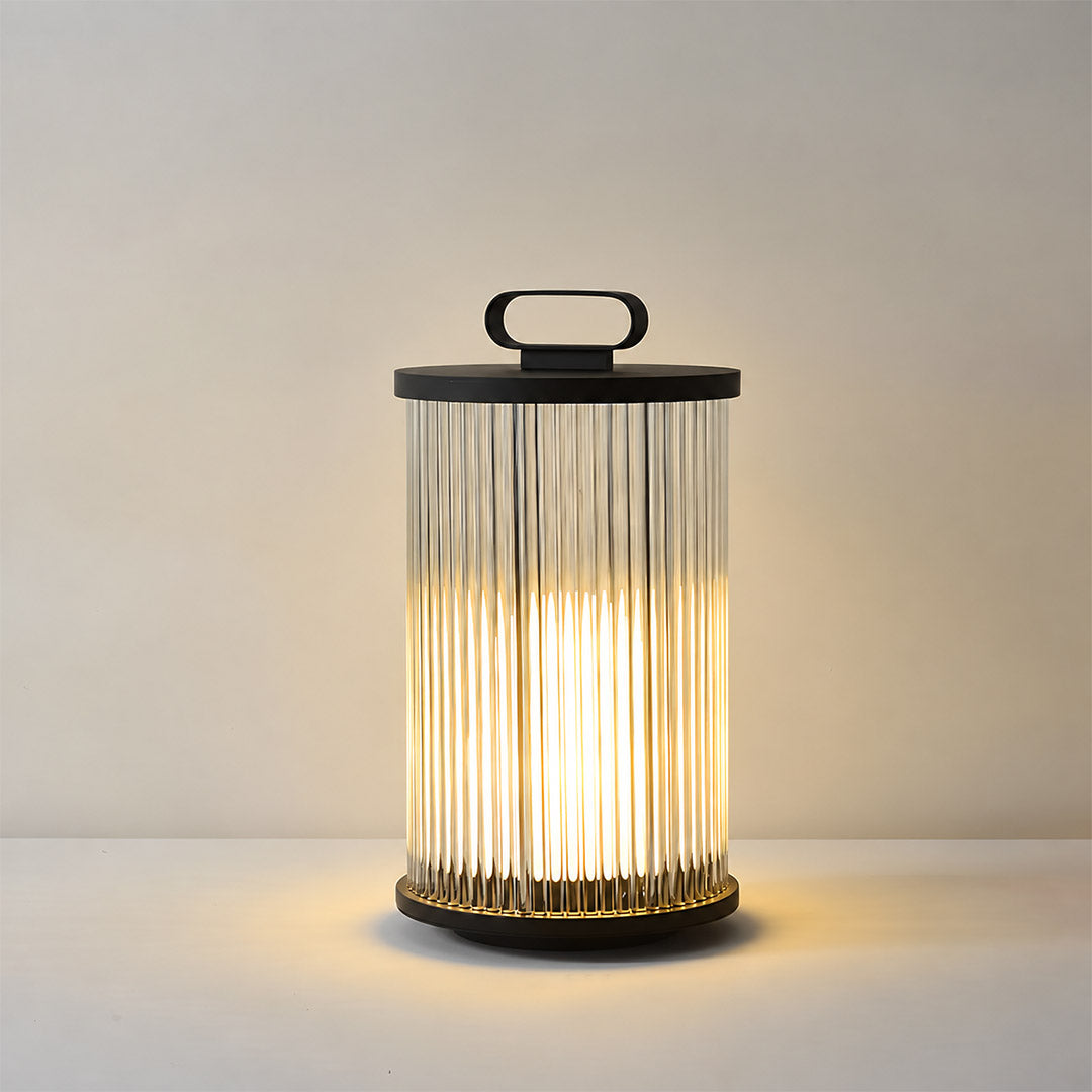 Small 14.2-inch hardwired Torre outdoor garden light on a low garden wall