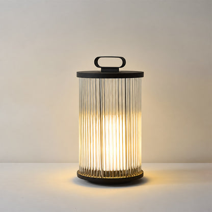 Small 14.2-inch hardwired Torre outdoor garden light on a low garden wall