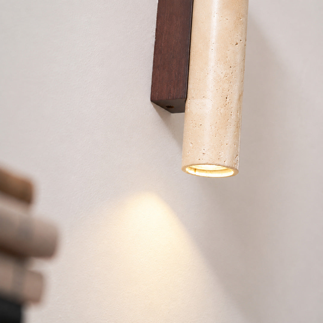 Torre travertine wall sconce yellow travertine natural stone veining porous texture column detail close up unique