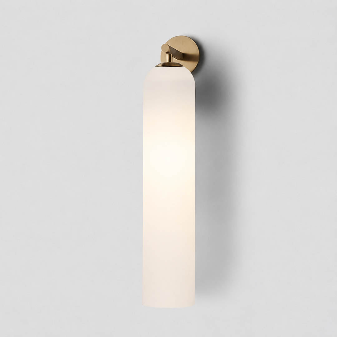 Torva glass wall sconce gold clear cylinder glass shade modern minimal white background front view