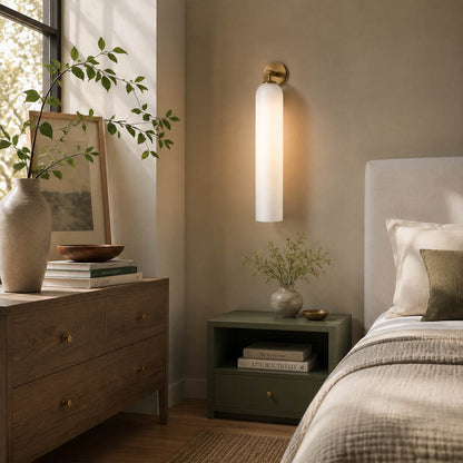 Torva glass wall sconce bedroom bedside cylinder glass warm glow modern quiet luxury American home lifestyle interior styled