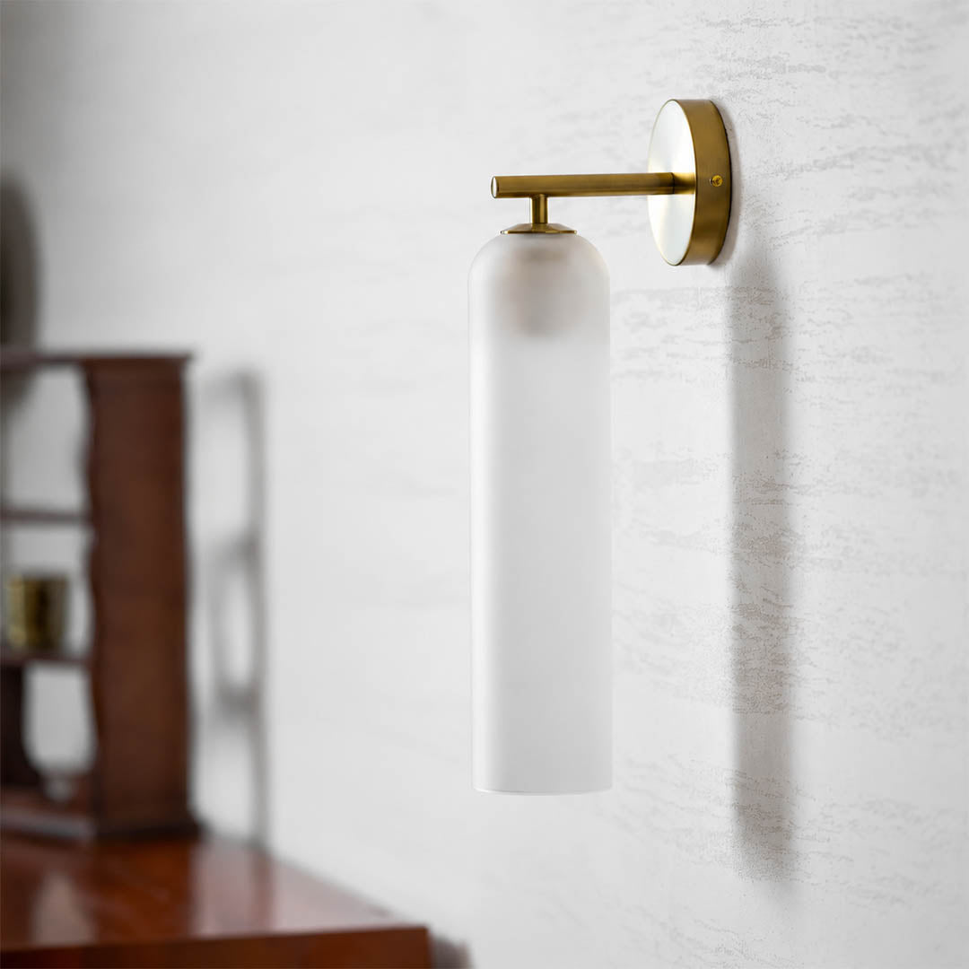 Torva glass wall sconce cylinder glass shade tube form detail close up craftsmanship translucent