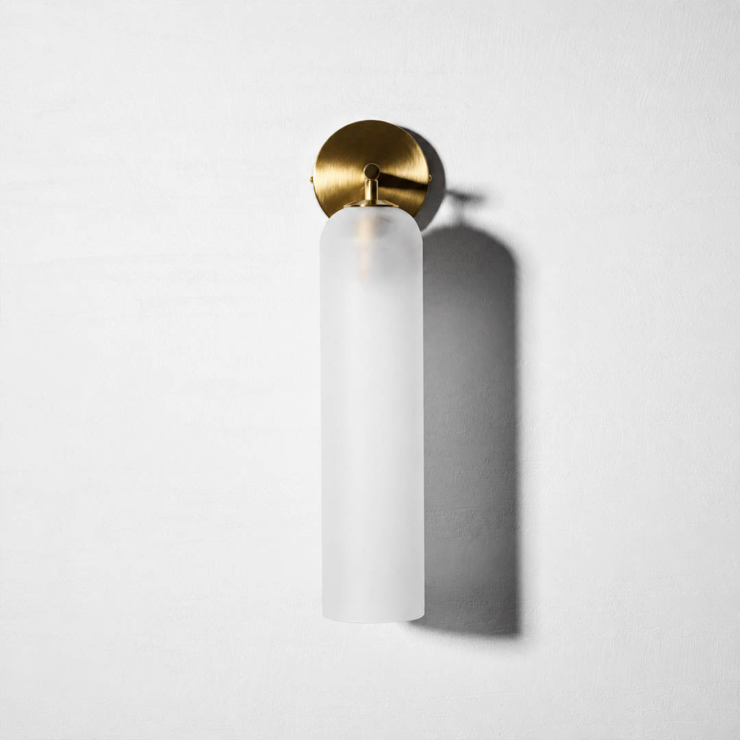 Torva glass wall sconce cylinder glass shade tube form detail close up craftsmanship translucent