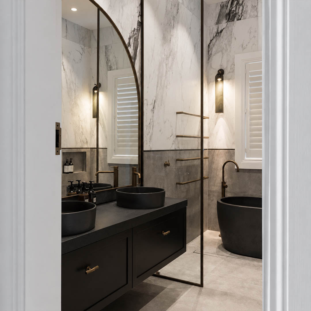 Torva glass wall sconce illuminated evening wall cylinder glass warm glowing cozy American home lifestyle interior