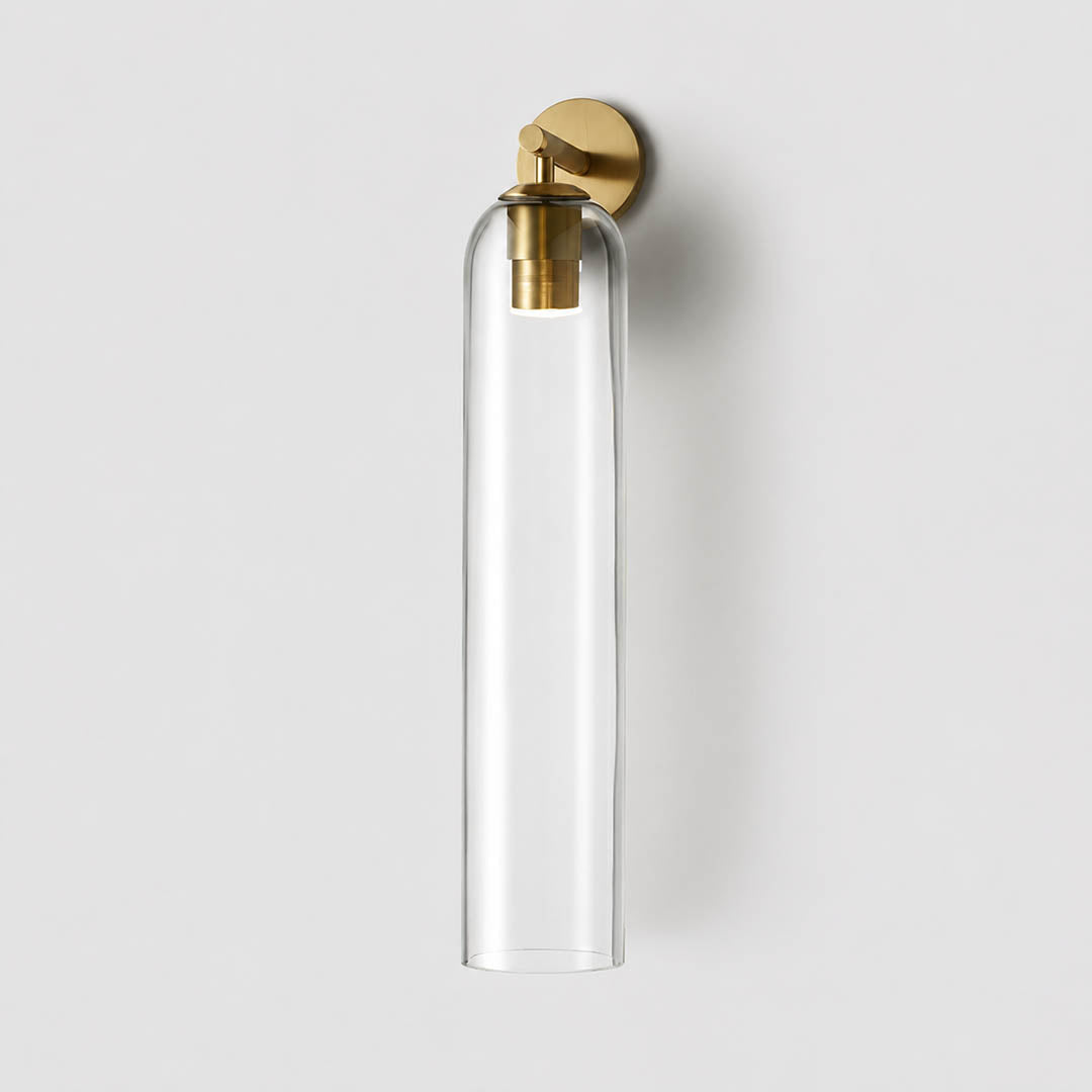 Torva glass wall sconce gold clear cylinder glass shade modern minimal white background front view