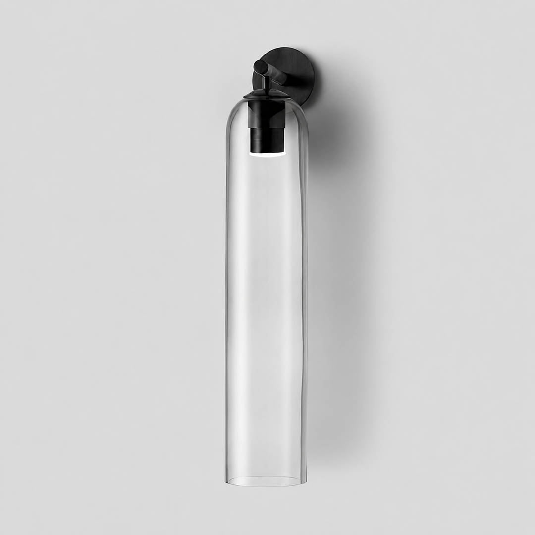 Torva glass wall sconce gold clear cylinder glass shade modern minimal white background front view