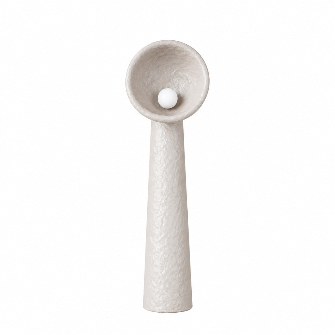 Medium 39.4-inch Totem sculptural floor lamp beside a sofa in a living room