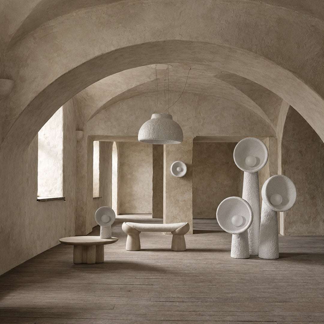 Totem sculptural floor lamp displayed as a functional light sculpture in a contemporary gallery