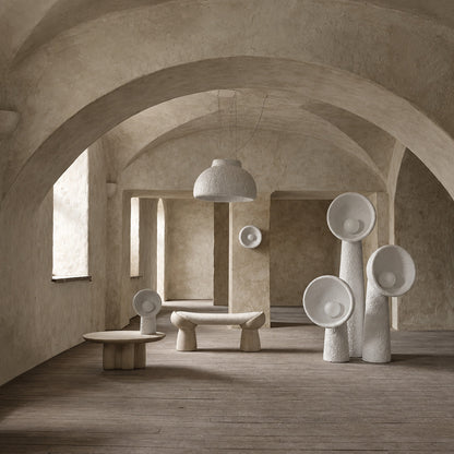 Totem sculptural floor lamp displayed as a functional light sculpture in a contemporary gallery