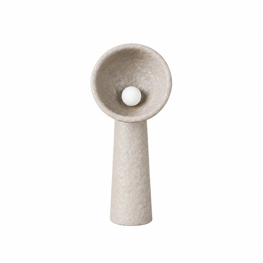 Totem sculptural floor lamp with a stacked textured base and a soft glowing orb in a living room