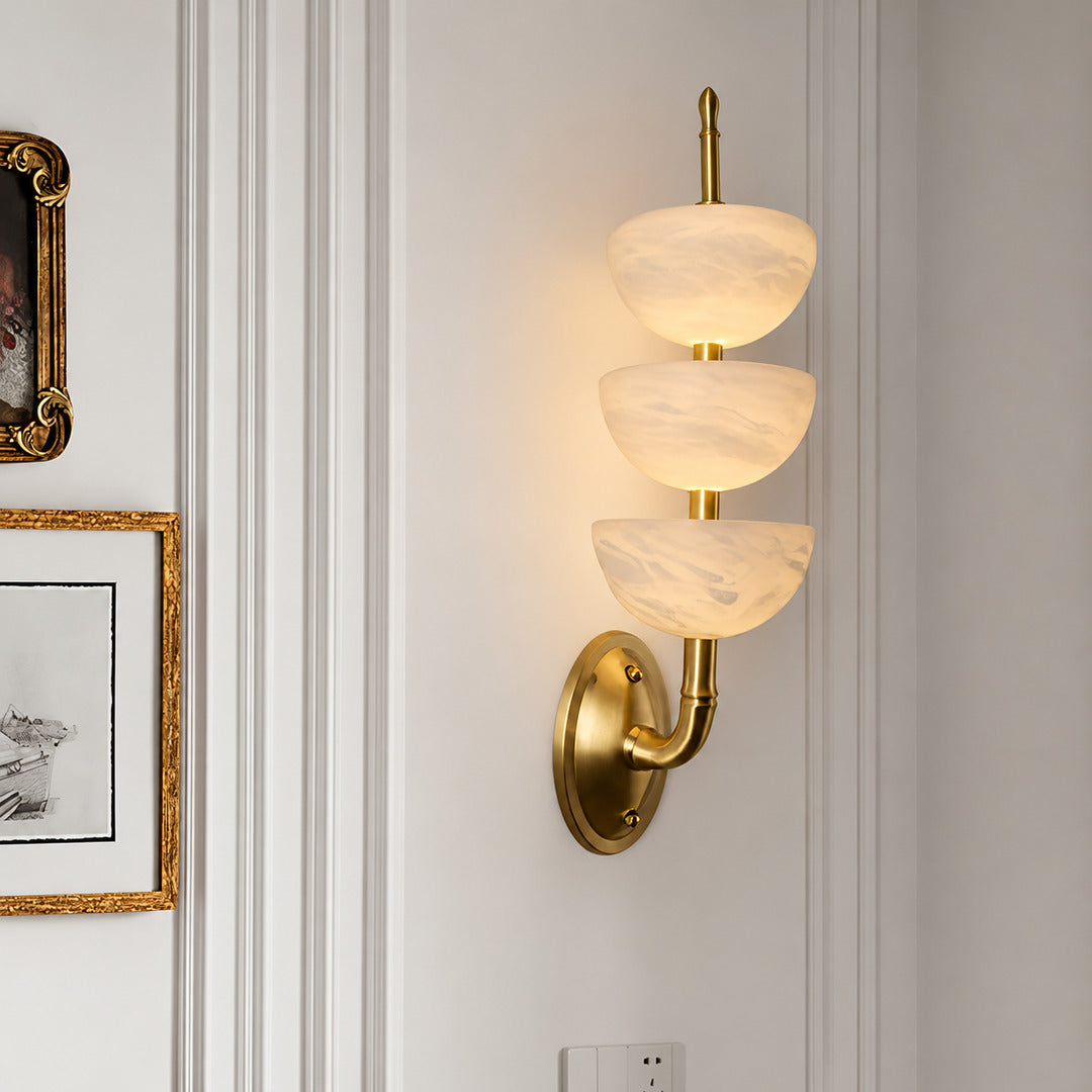 Trio alabaster wall sconce as a warm sculptural accent on a modern living room wall