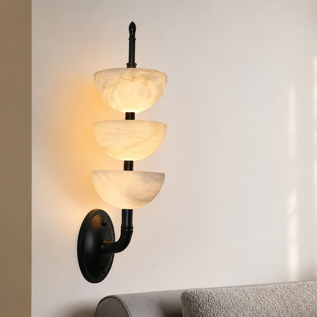 Trio alabaster wall sconce suiting a warm Japandi space with natural stone and wood tones