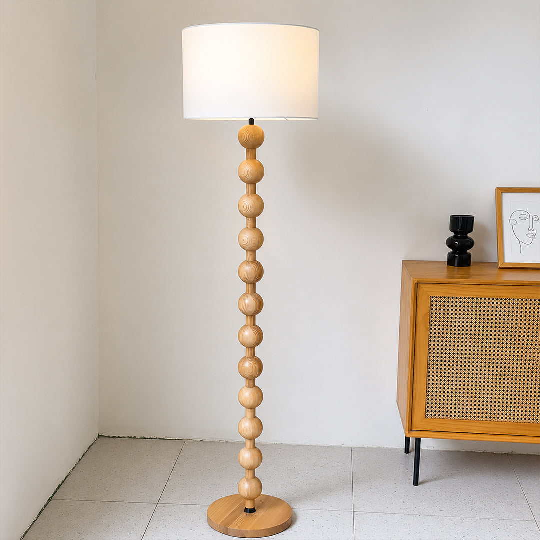 Tronco floor lamp modern living room TV lounge coffee table beside walnut nature wood tall 63 inch statement natural wood white fabric shade Scandinavian warm ambient relaxed evening lifestyle interior American home