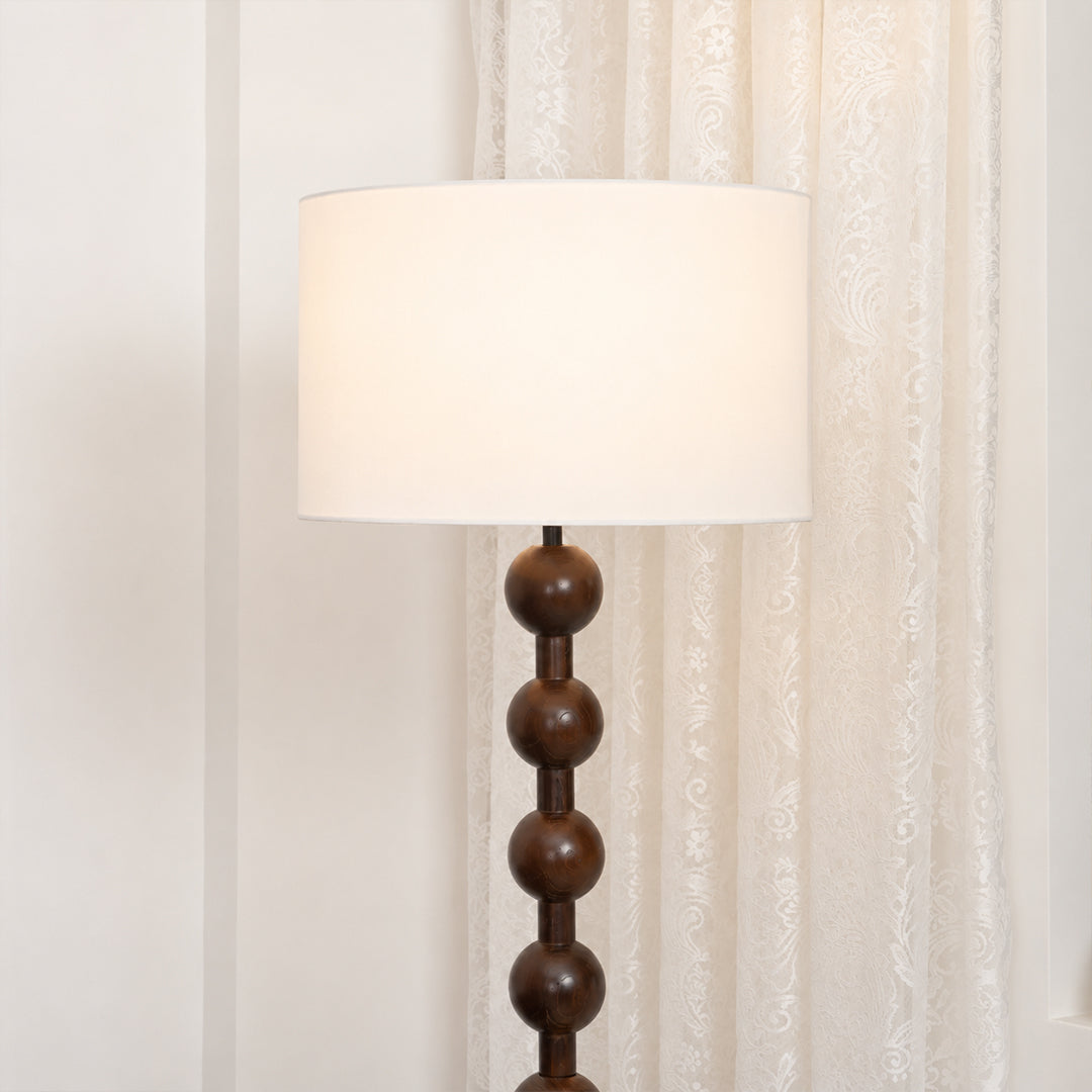 Tronco floor lamp white fabric drum shade linen texture soft diffused evening warm glow detail close up craftsmanship handmade