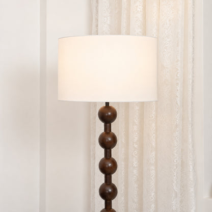 Tronco floor lamp white fabric drum shade linen texture soft diffused evening warm glow detail close up craftsmanship handmade