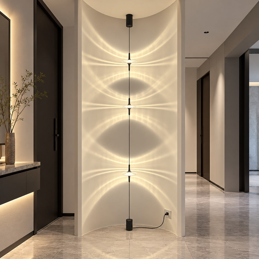 Row of Trottola lamps casting star light along a boutique hotel corridor