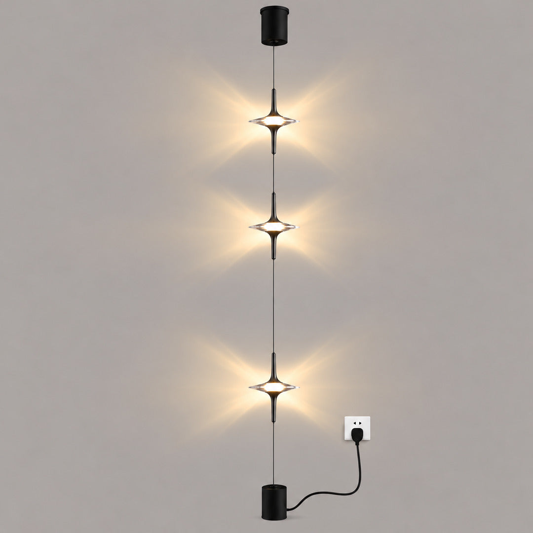 Black Trottola floor-to-ceiling lamp with three crystal star LED heads