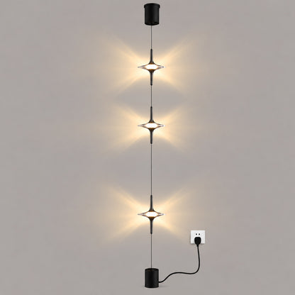 Black Trottola floor-to-ceiling lamp with three crystal star LED heads