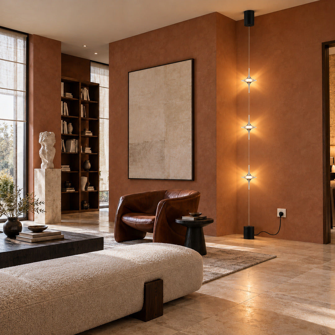 Trottola floor-to-ceiling lamp framing one side of a TV media wall with soft star patterns