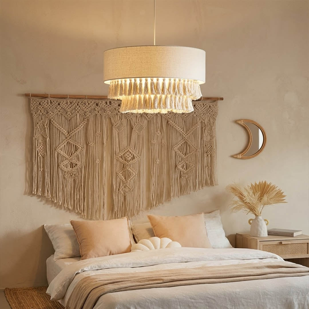 Tulum jute pendant light above bed warm sun-washed glow coastal boho bedroom interior