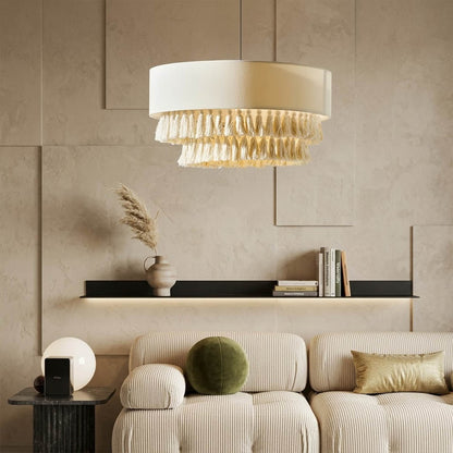 Tulum jute pendant light above bed warm sun-washed glow coastal boho bedroom interior