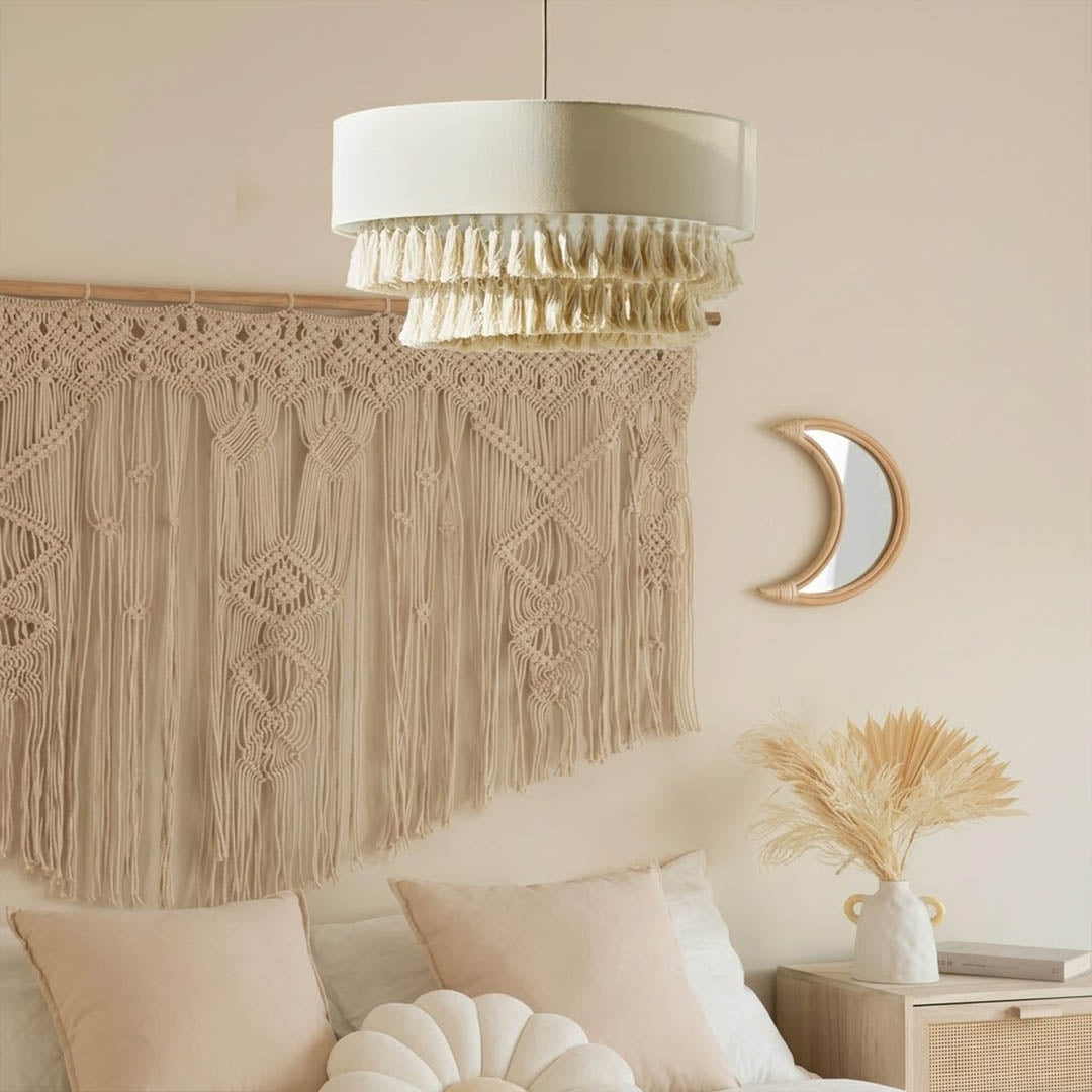 Tulum jute pendant light above bed warm sun-washed glow coastal boho bedroom interior