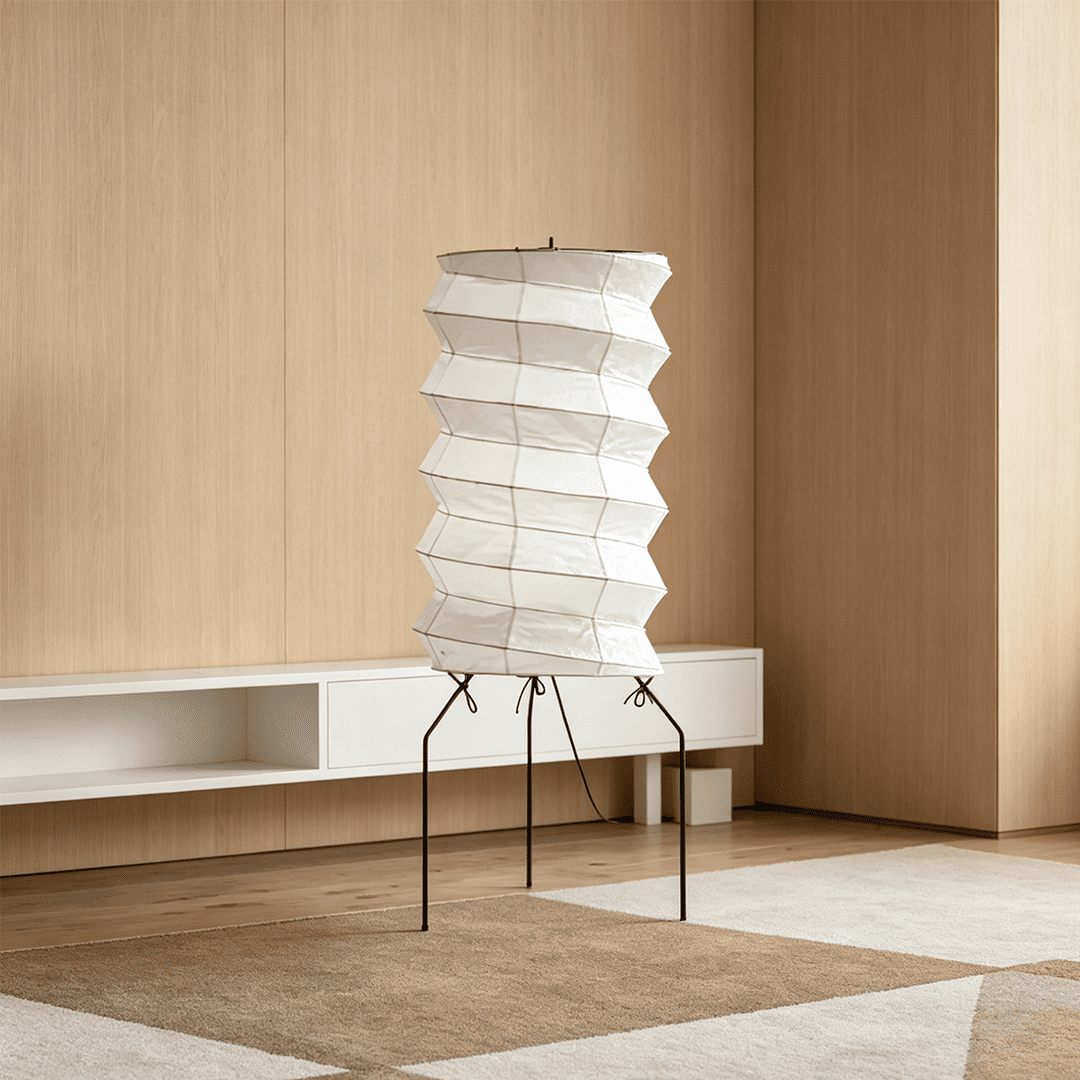 UF2-31N Washi paper table lamp with warm internal glow, handcrafted rice paper shade on black metal tripod legs.