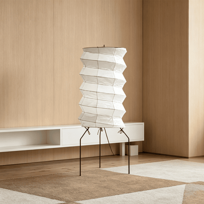 UF2-31N Washi paper table lamp with warm internal glow, handcrafted rice paper shade on black metal tripod legs.