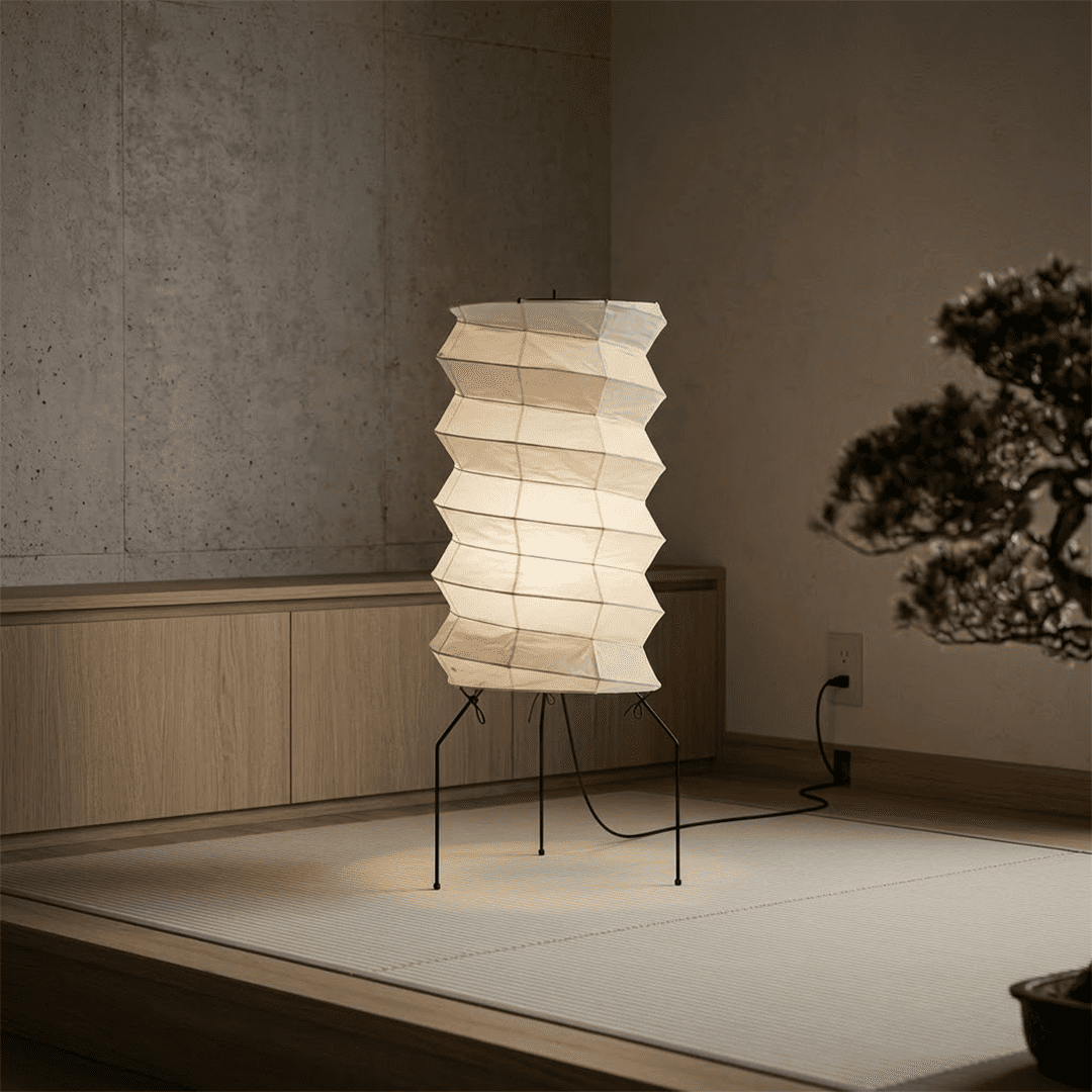 UF2-31N Washi paper table lamp with warm internal glow, handcrafted rice paper shade on black metal tripod legs.
