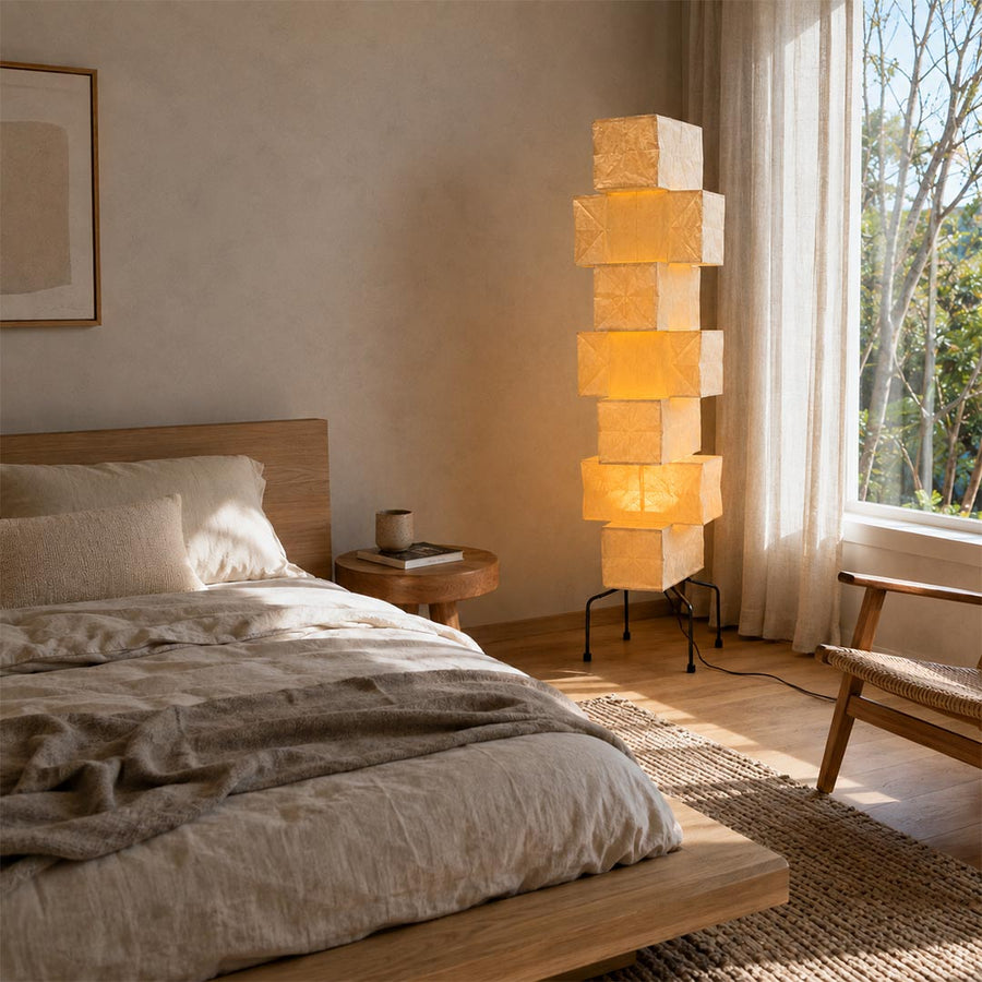 Japandi bedroom interior featuring an illuminated UF4-L10 washi paper stacked tower floor lamp by the bed