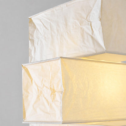 Close-up view of the stacked geometric paper shades on the UF4-L10 washi paper tower floor lamp