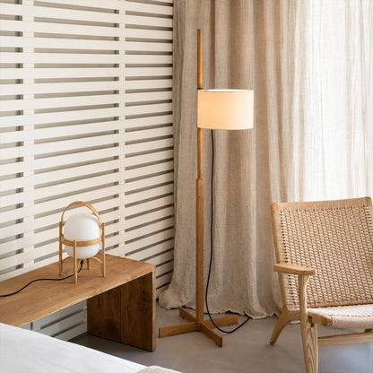 Vara floor lamp walnut wood modern bedroom reading corner armchair Miguel Mila inspired Scandinavian warm rich brown wooden rod beige linen drum warm ambient intimate lifestyle interior