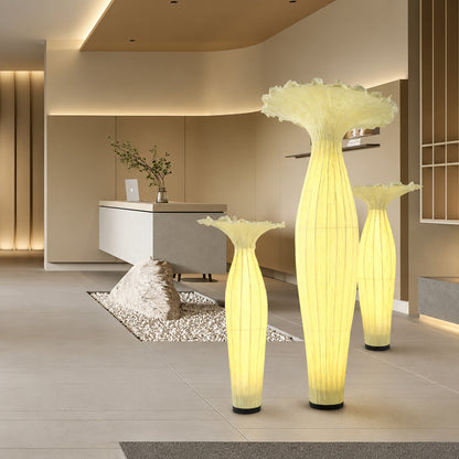 Vaso fabric floor lamps lighting a modern hotel lounge with a warm glow