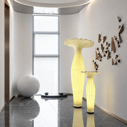 Yellow Vaso fabric floor lamp highlighting a design-forward retail showroom corner