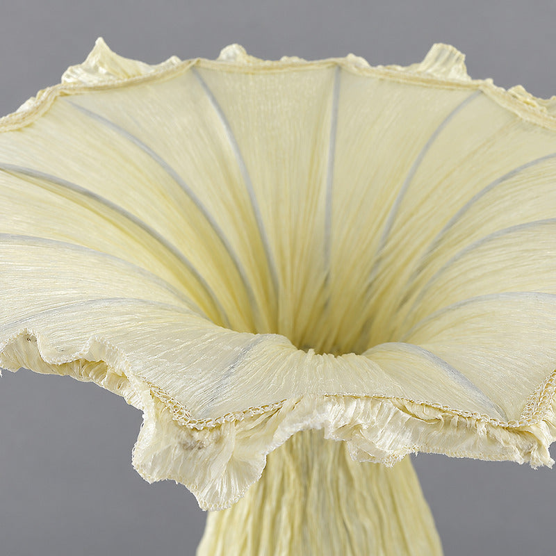 Close-up of the sculptural vase-shaped fabric shade of the Vaso floor lamp