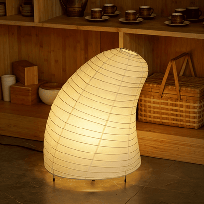 Handcrafted VB-13T Washi paper table lamp with an organic sculptural shape, emitting a warm 2700K glow in a Japandi style interior.