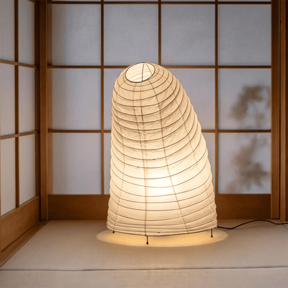 Handcrafted VB-13T Washi paper table lamp with an organic sculptural shape, emitting a warm 2700K glow in a Japandi style interior.