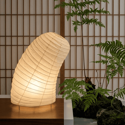 Handcrafted VB-13T Washi paper table lamp with an organic sculptural shape, emitting a warm 2700K glow in a Japandi style interior.