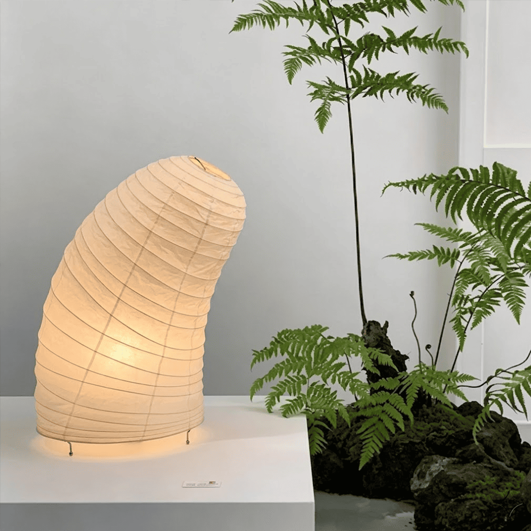 Handcrafted VB-13T Washi paper table lamp with an organic sculptural shape, emitting a warm 2700K glow in a Japandi style interior.