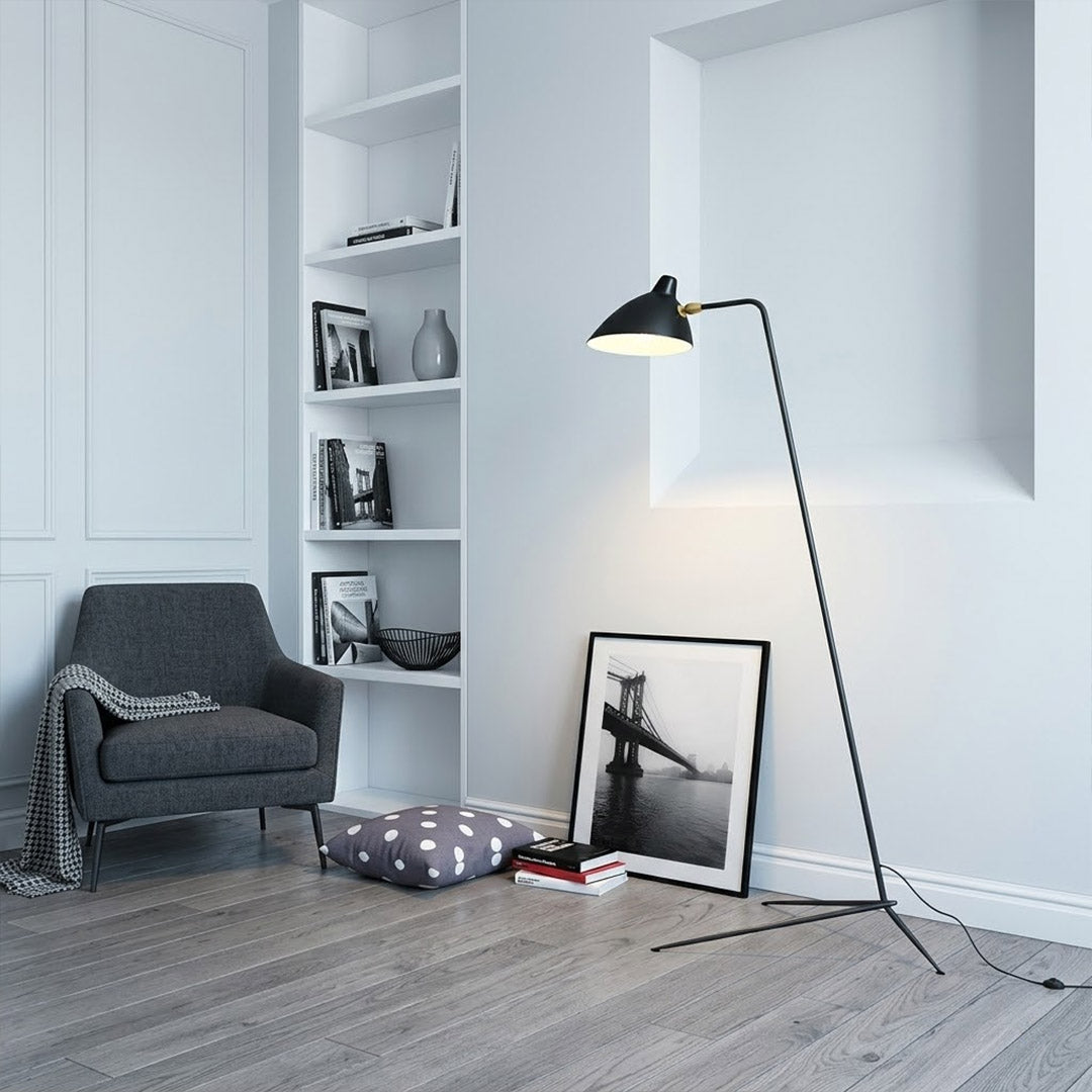 Vega mid century floor lamp next to reading armchair modern living room matte black sculptural statement white neutral interior