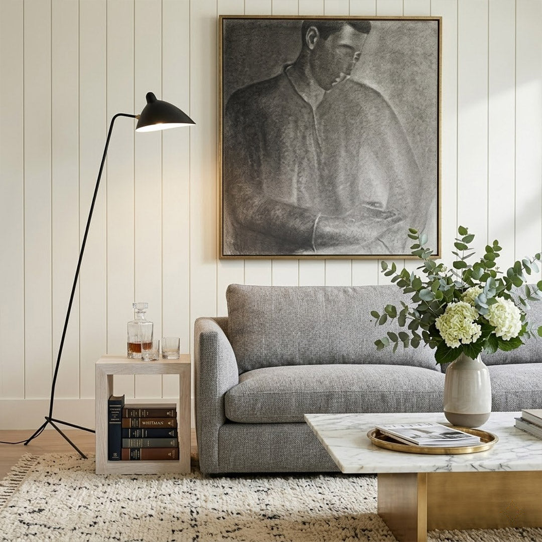 Vega tripod floor lamp behind sofa corner positioned long articulated arm reaching over seating area modern interior