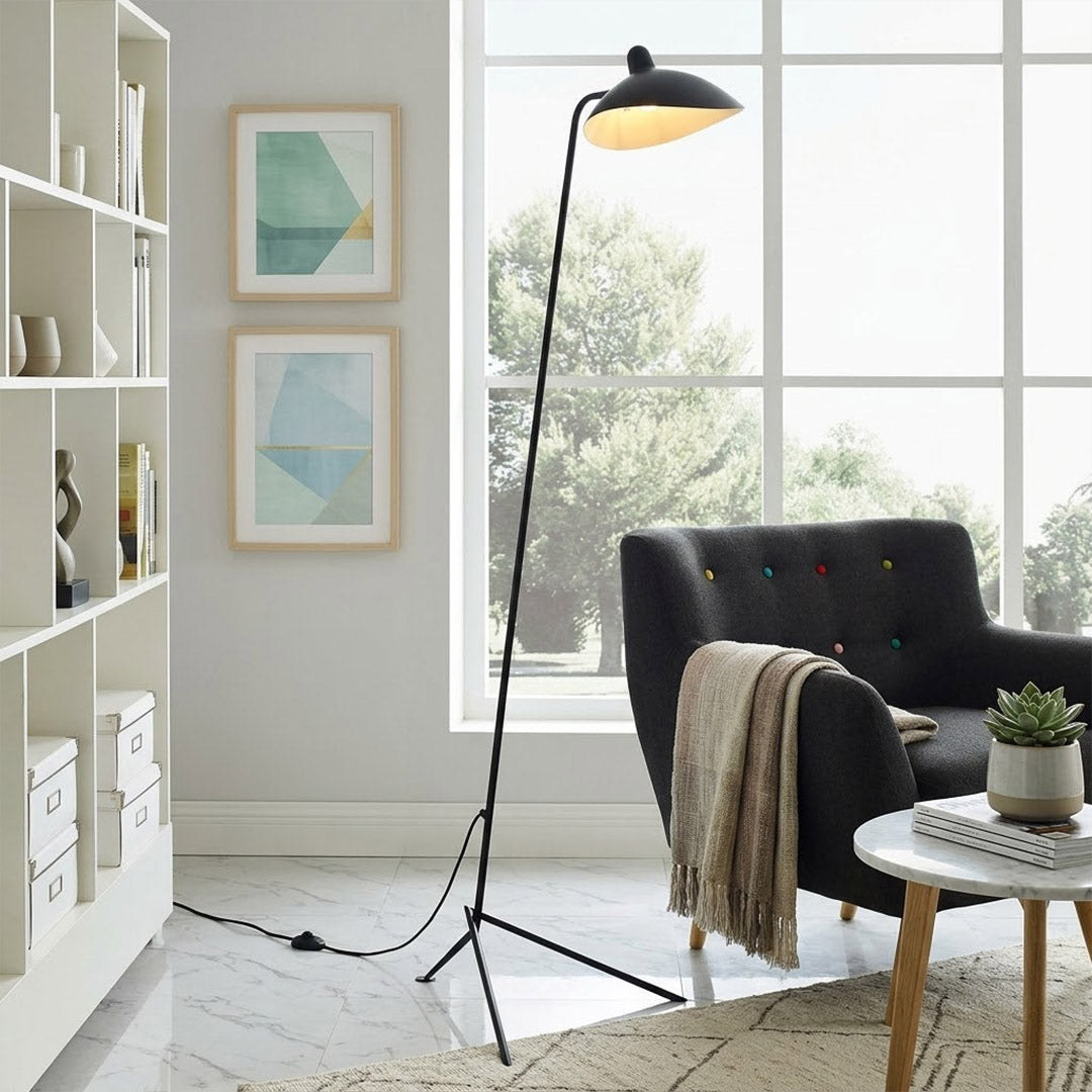 Vega mid century floor lamp next to reading armchair modern living room matte black sculptural statement white neutral interior