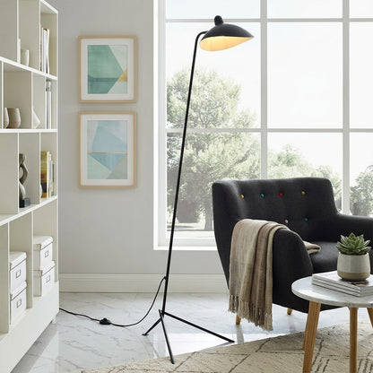 Vega mid century floor lamp next to reading armchair modern living room matte black sculptural statement white neutral interior