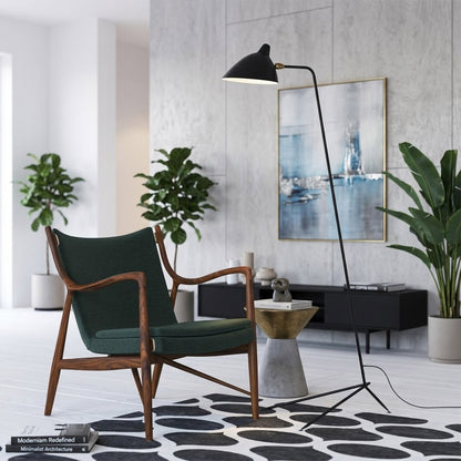 Vega mid century floor lamp next to reading armchair modern living room matte black sculptural statement white neutral interior